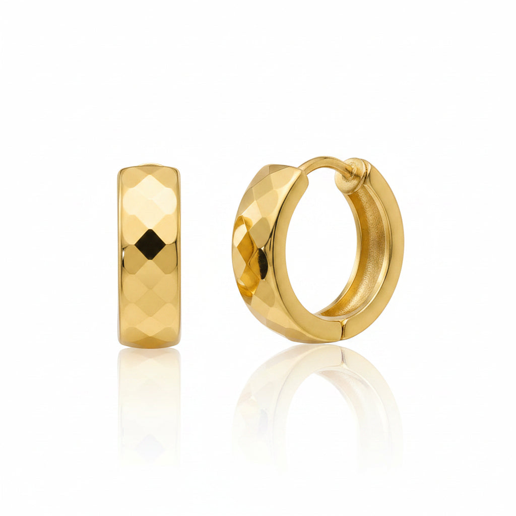 A pair of gold hoop earrings on a plain white background, one shown from a front-facing perspective with a faceted geometric pattern and the other from a side profile showing the hinged clasp.