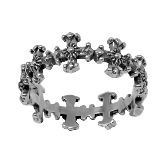 A silver ring featuring a pattern of crosses around its circumference.