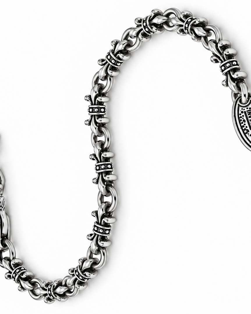 A silver-toned metal chain bracelet with textured links, a lobster clasp, and an oval charm engraved with the brand name 'Missoni'.