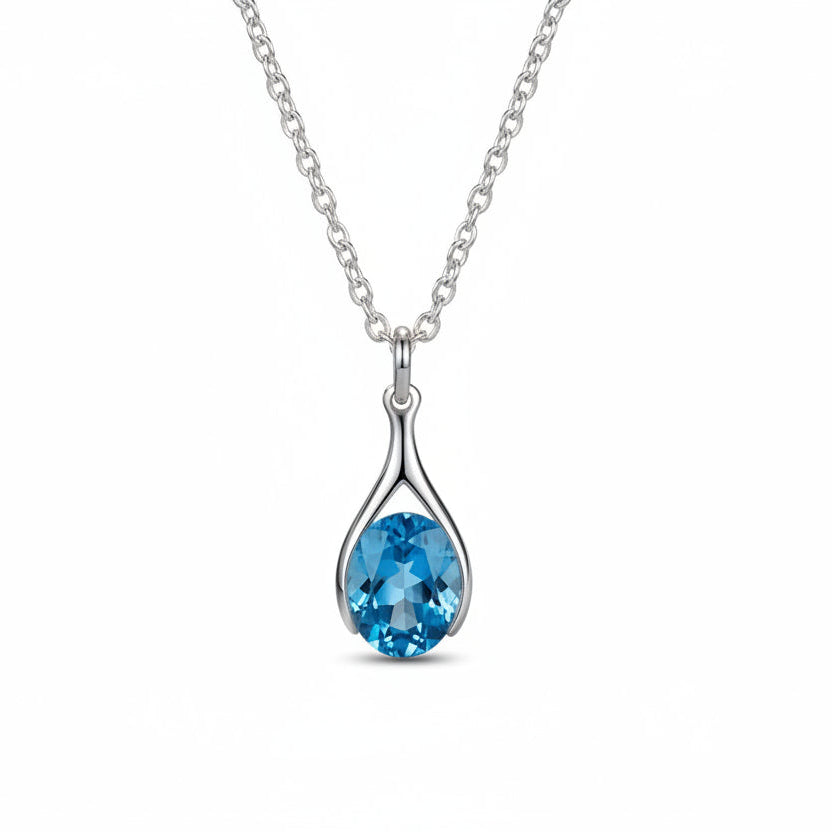 Versani NY Petite Women's Teardrop Pendant in Sterling Silver with a Pear-Cut Blue Topaz gemstone.
