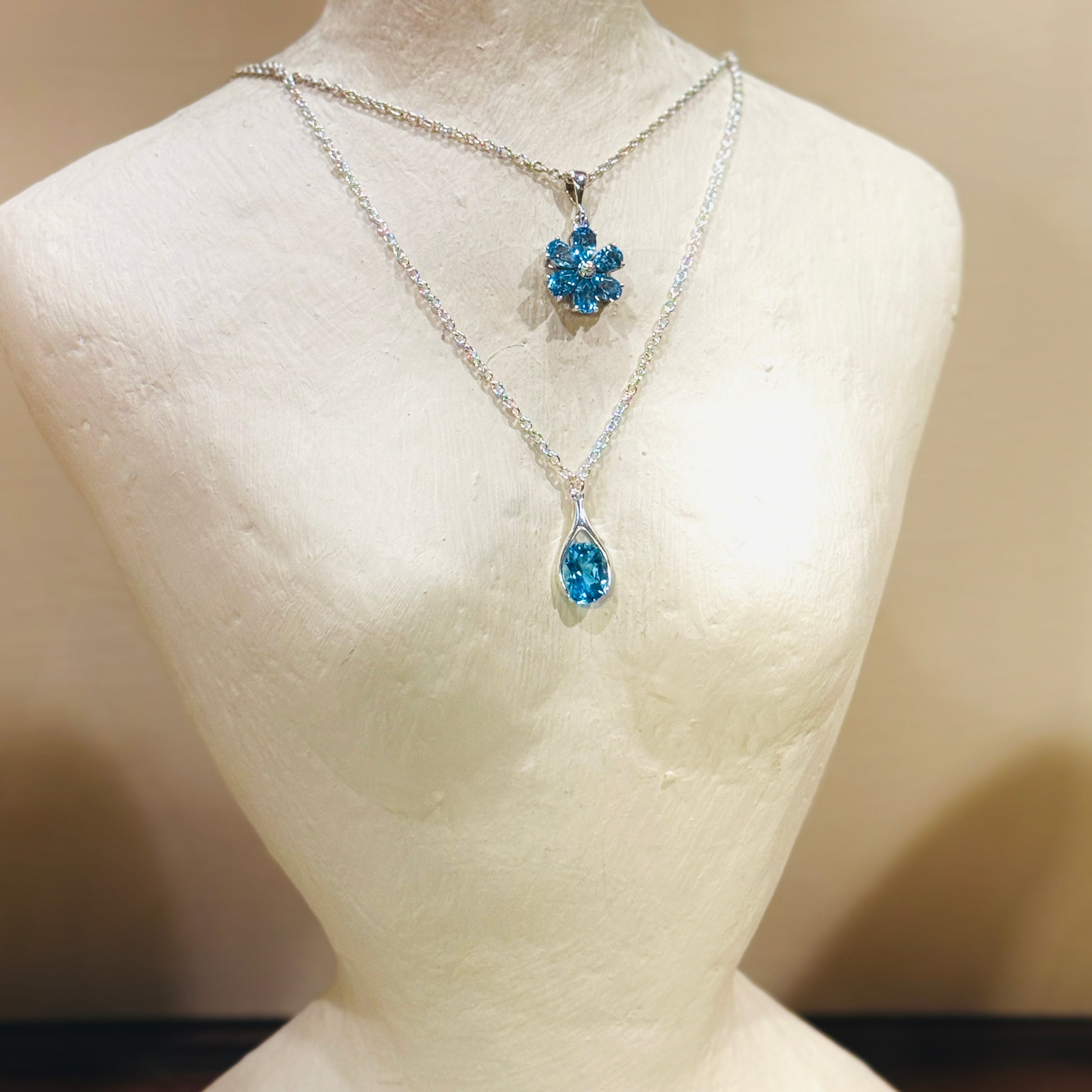Versani NY Petite Women's Teardrop Pendant in Sterling Silver with a Pear-Cut Blue Topaz gemstone.