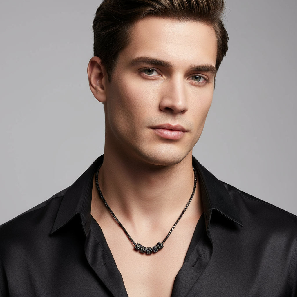 Black diamond cylinders necklace on a white background