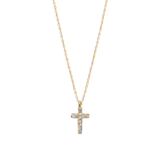 Gold cross necklace with diamonds on a white background