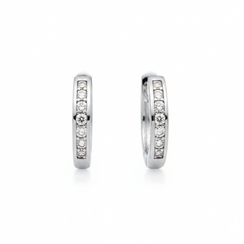 white gold hoop earrings with embedded diamonds on a white background