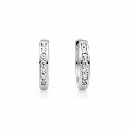 white gold hoop earrings with embedded diamonds on a white background