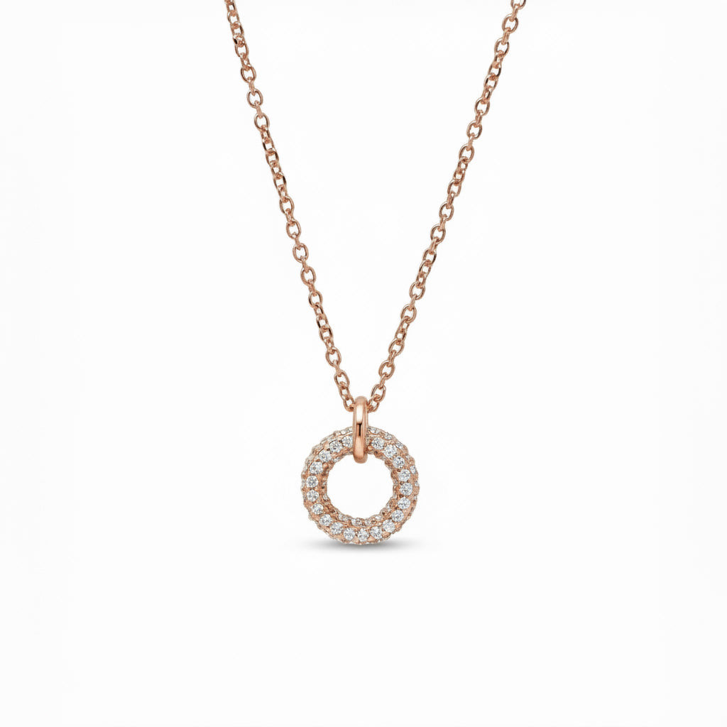Rose gold necklace with a circular pendant on a white background