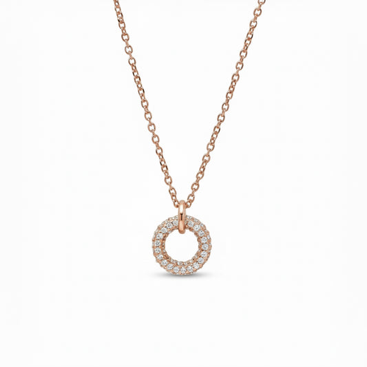 Rose gold necklace with a circular pendant on a white background