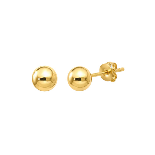 Gold ball earrings on a white background
