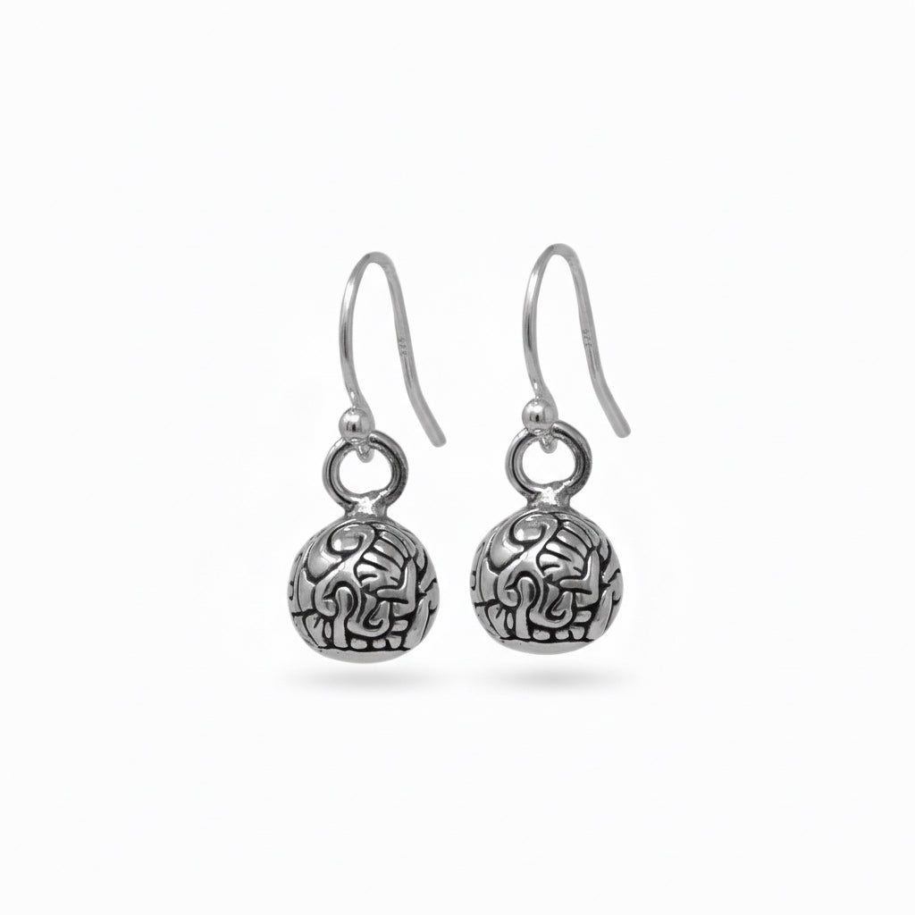 A pair of silver-colored ball dangling earrings with a geometric pattern.