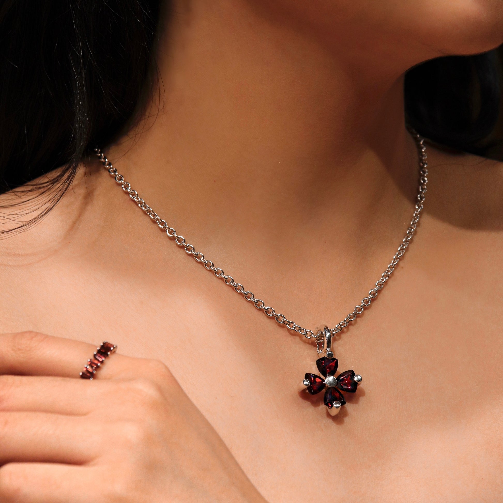 Versani Soho Women's Large Statement Flower Pendant in Sterling Silver with Blue Topaz and Garnet gemstones.