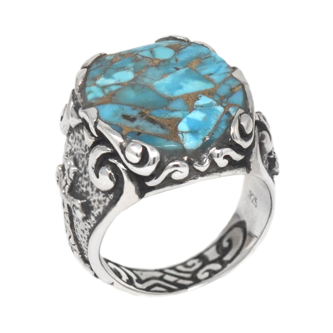 Silver ring with a large turquoise stone on a white background