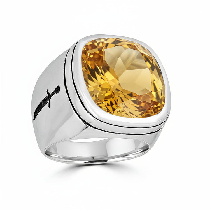Silver ring with a citrine gemstone on a white background