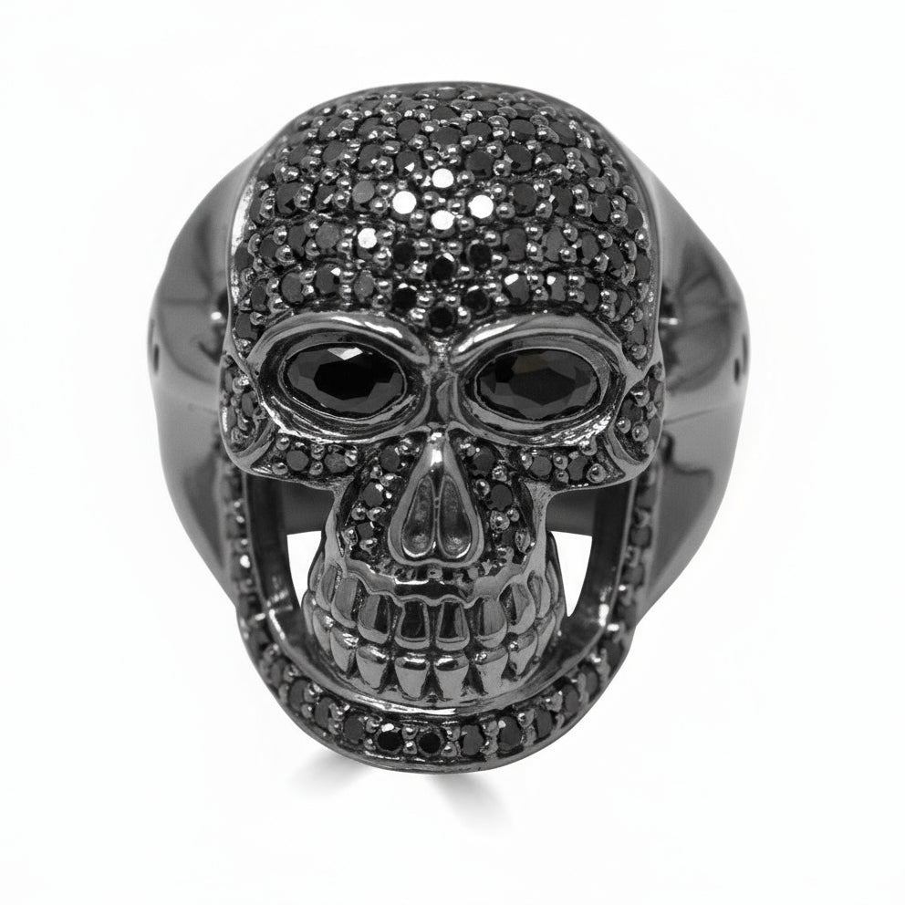 A men's ring featuring a black diamond skull design with a polished finish.