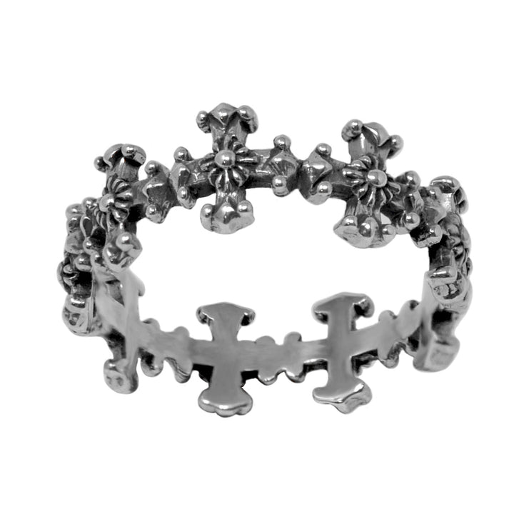 A silver ring featuring a pattern of crosses around its circumference.