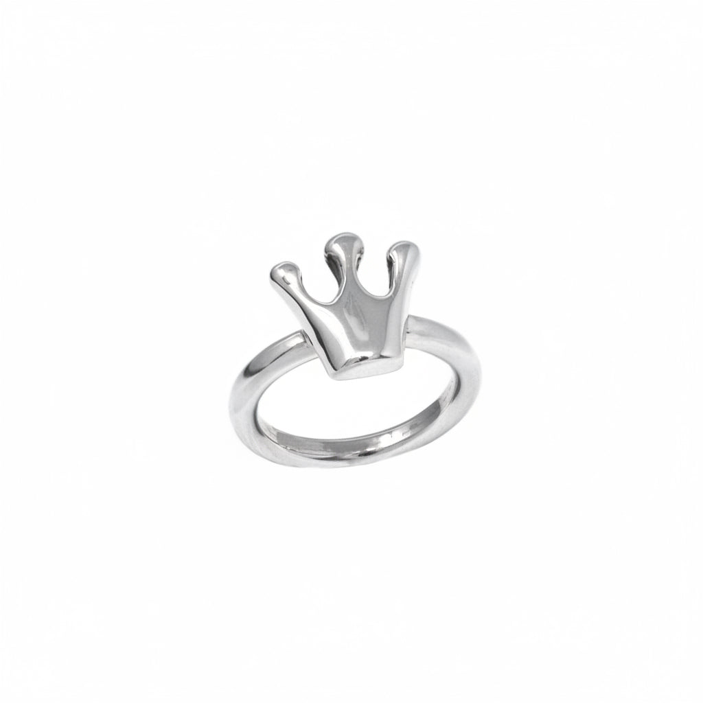 Silver crown-shaped ring on a white background